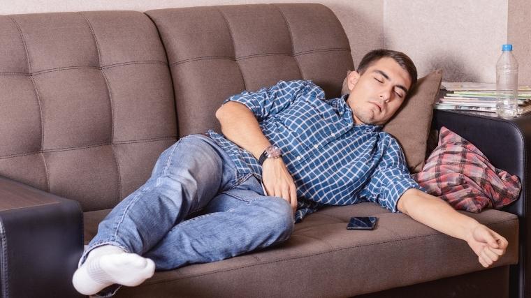 Man asleep on couch