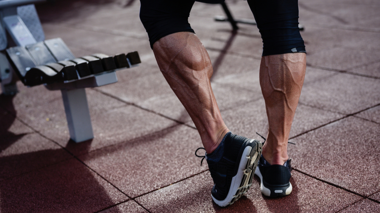 man flexing calves 