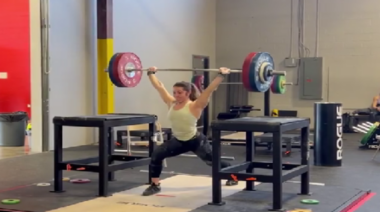 Katie Estep jerks 119kg during training.