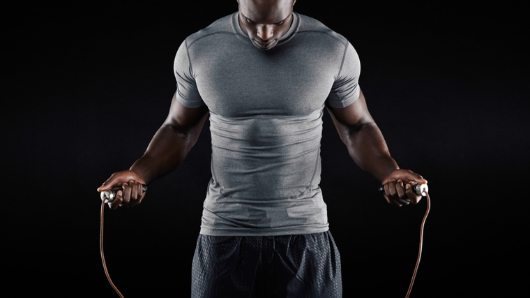 man preparing for skip rope