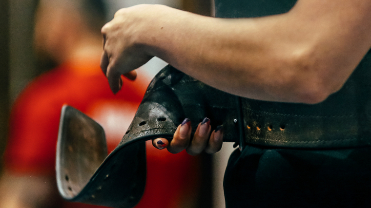 woman binding a lifting belt