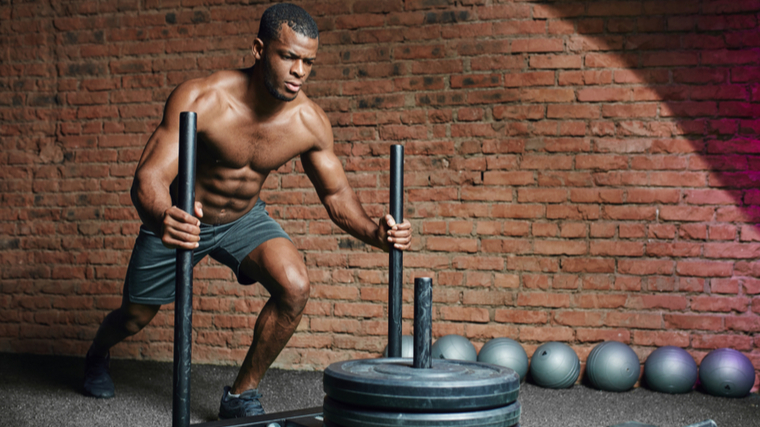 A person performs a prowler push.