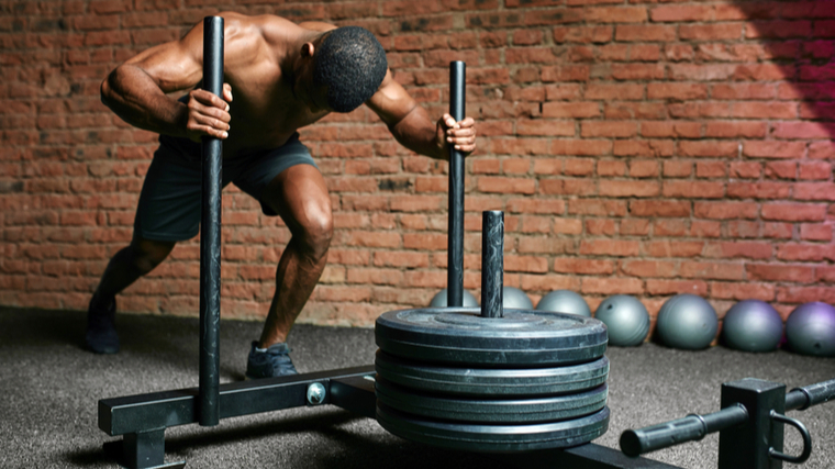 A person performs a prowler push.