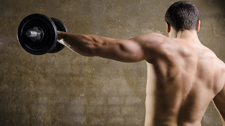 man doing lateral raise with dumbbell