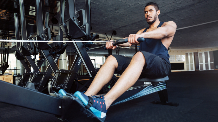 A person rows in the gym.