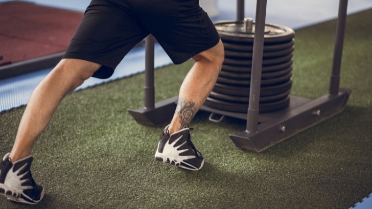 A sled loaded with many weight plates