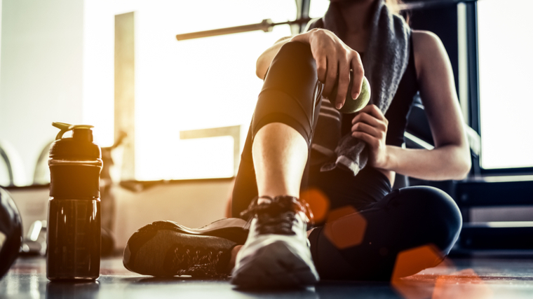 A person sits to rest in the gym.