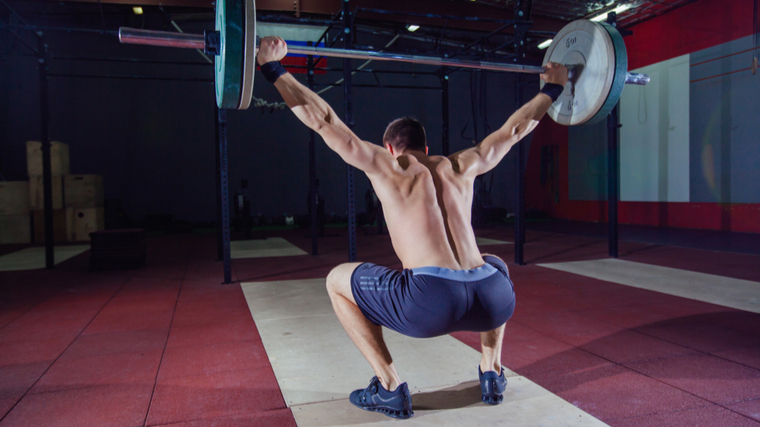 man doing overhead squat