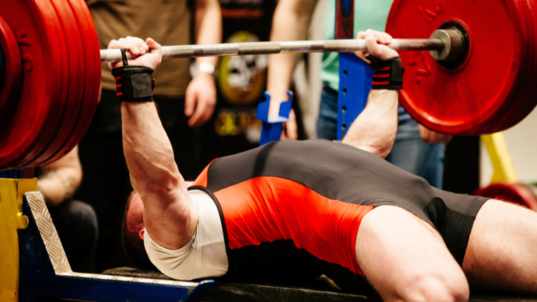 man attempting bench press