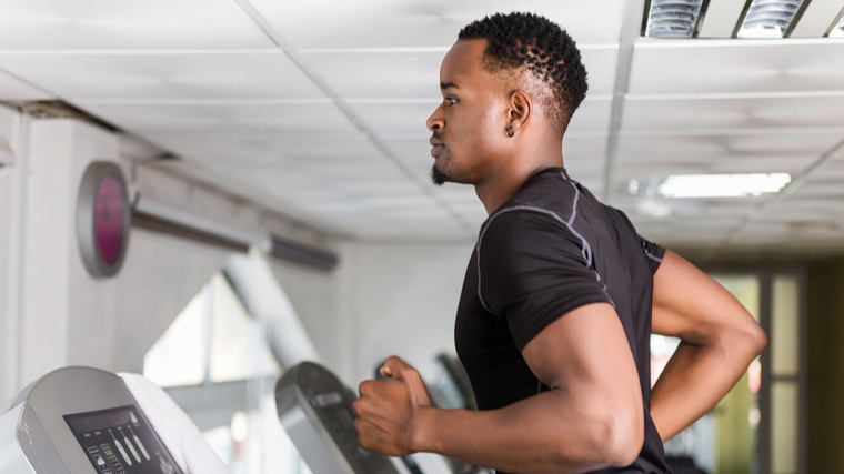 A person jogs on the treadmill.