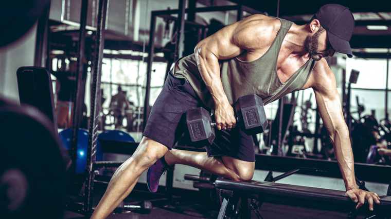 man performing dumbbell row