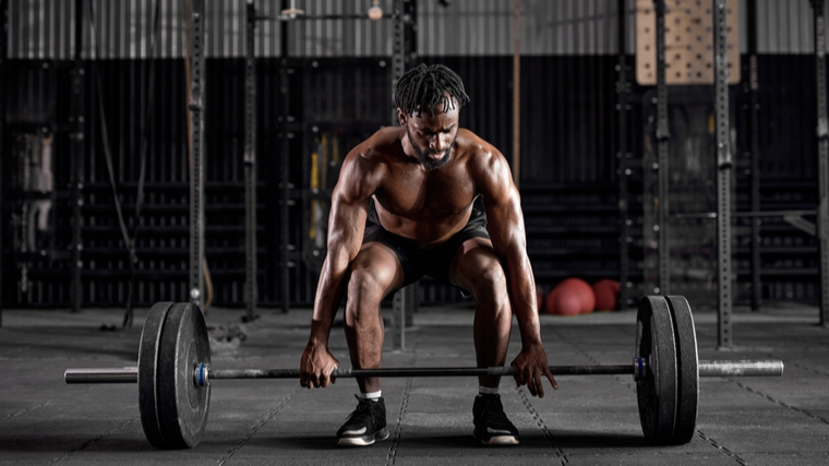 A person prepares to deadlift.