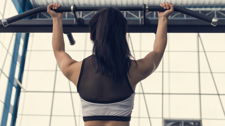 A person performs a chin-up.