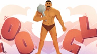 A cartoon drawing of Indian wrestler Gama Phelwan, wherein he's wearing brown trunks and is holding a steel mace over his shoulder.
