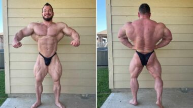 Hunter labrada hitting a front lat spread and back lat spread wearing black posing trunks in front of a yellow house