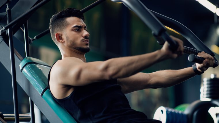 man performs decline chest press