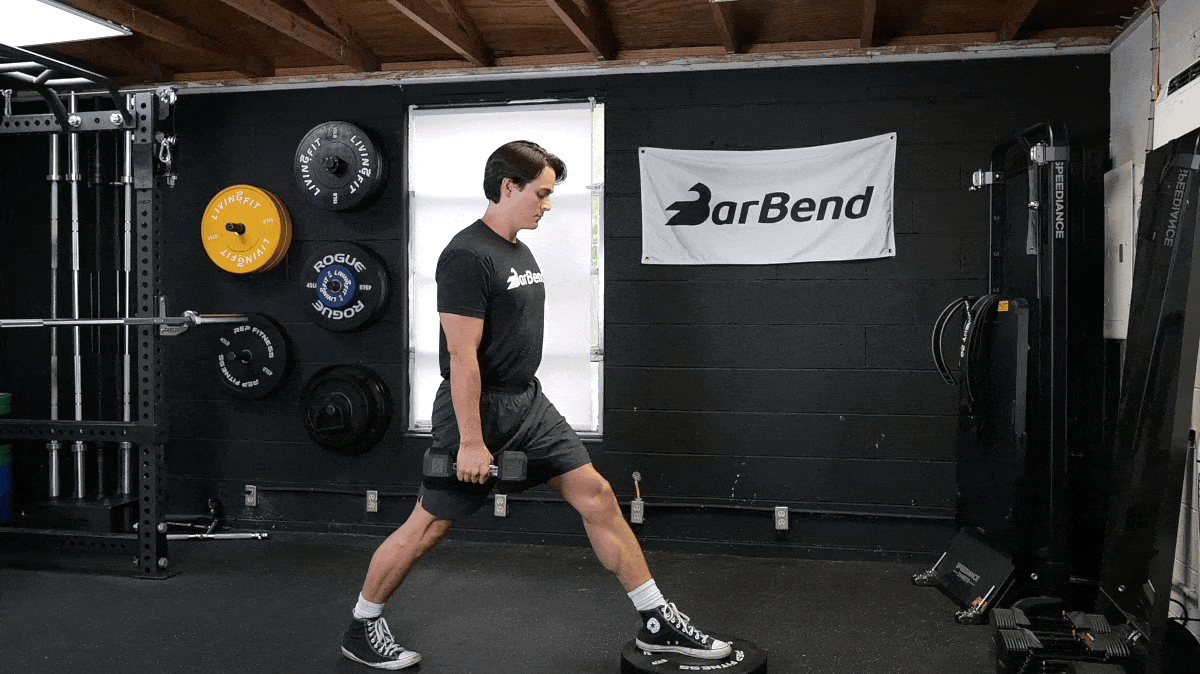 Jake performing the Front-Foot-Elevated Split Squat in the BarBend gym.