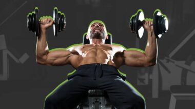 A person doing chest exercises with dumbbells on a bench.