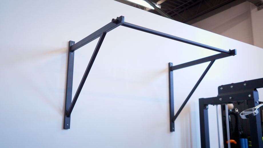 Titan Fitness Wall-Mount pull-up bar in a gym