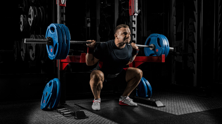 Man Squatting with Weightlifting Shoes
