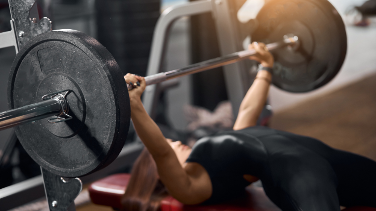 woman sets up for bench press