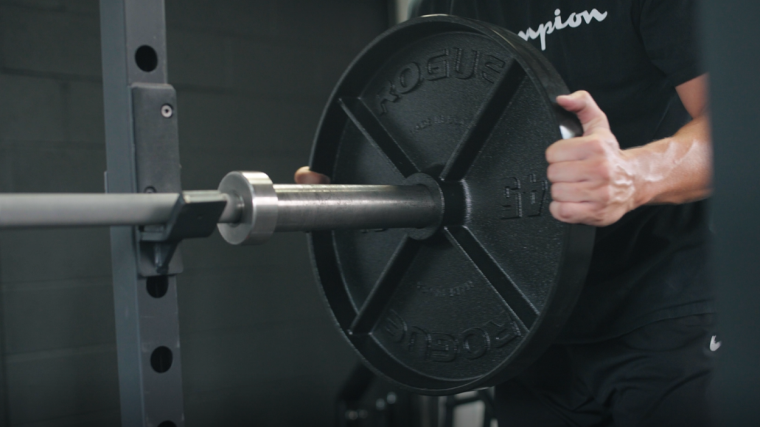 Loading Rogue's Deep Dish Plates Onto A Barbell