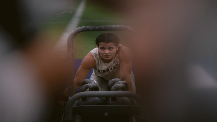 Mal O'Brien pushes the Alpaca Sled during the 2022 CrossFit Games.