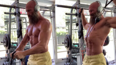 WWE Superstar Ciampa lifting weights in the gym.