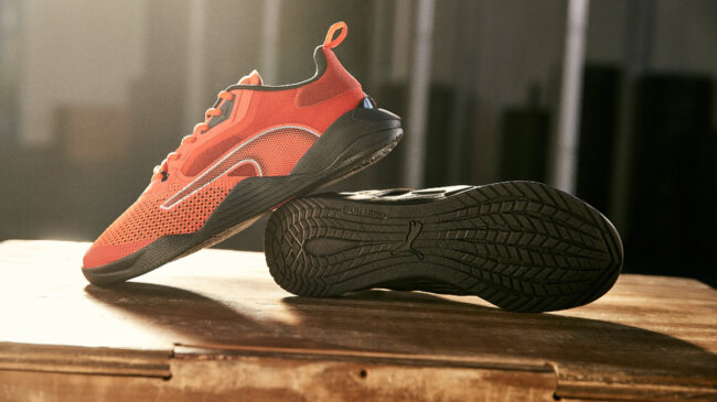 A photo of red PUMA FUSE 2.0 sneakers on a table.