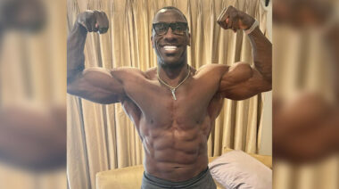 NFL Hall of Famer Shannon Sharpe poses shirtless.