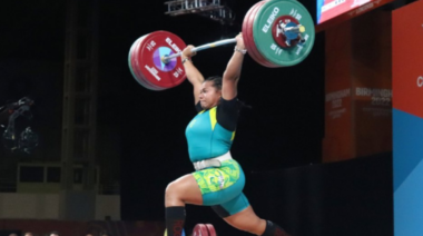 Eileen Cikamatana performs a clean & jerk in competition.