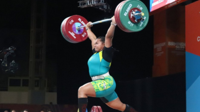Eileen Cikamatana performs a clean & jerk in competition.