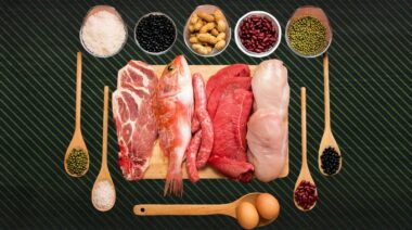 Top view of different kinds of protein-rich food on a chopping board and in wooden spoons.