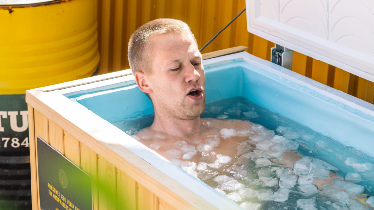 Man Dunking In Cold Plunge