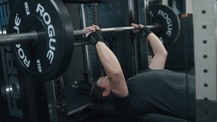 Jake benching with the Gymreapers Wrist Wraps