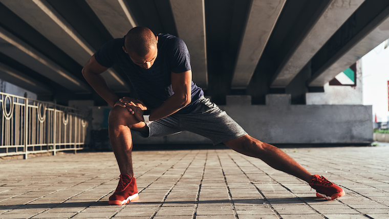 Having,A,Good,Stretch.,Handsome,Young,African,Man,In,Sports