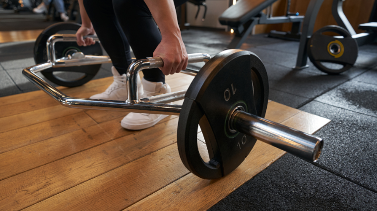 Athlete prepares to lift the trap bar