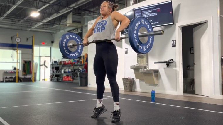 weightlifter extends hard during clean pull
