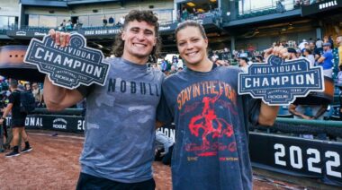 Justin Medeiros and Laura Horvath hold up their championship belts at the 2022 Rogue Invitational.