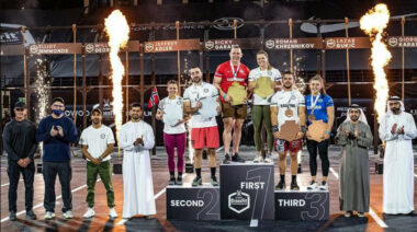 CrossFit athletes standing on a podium in Dubai.