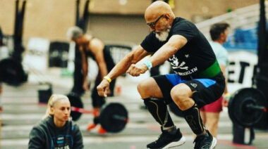 An athlete jumping on a CrossFit box.