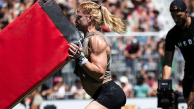 Annie Thorisdottir flips the pig implement on the competition field.