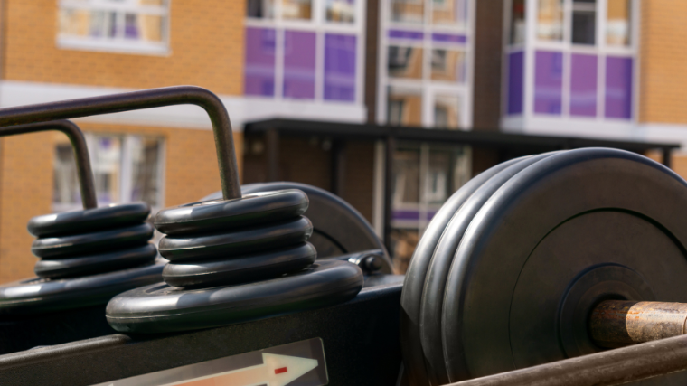 putting weights on plate-loaded gym machine