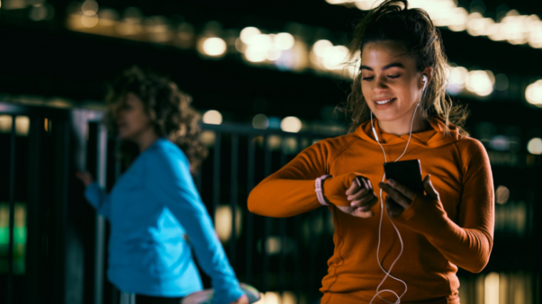 Athletes in gym timing workout before starting