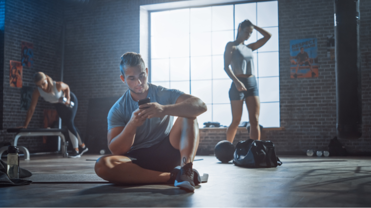 People in gym planning ang focusing workout in their own spaces