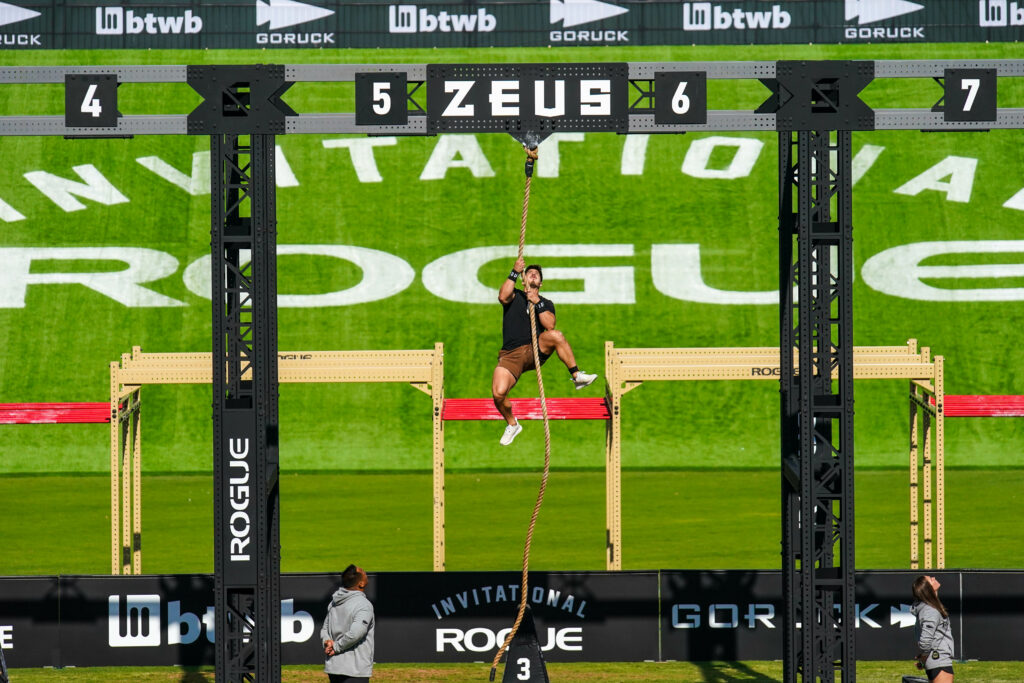 CrossFitter Jorge Fernandez ascends a rope during an event at the 2022 Rogue Invitational.