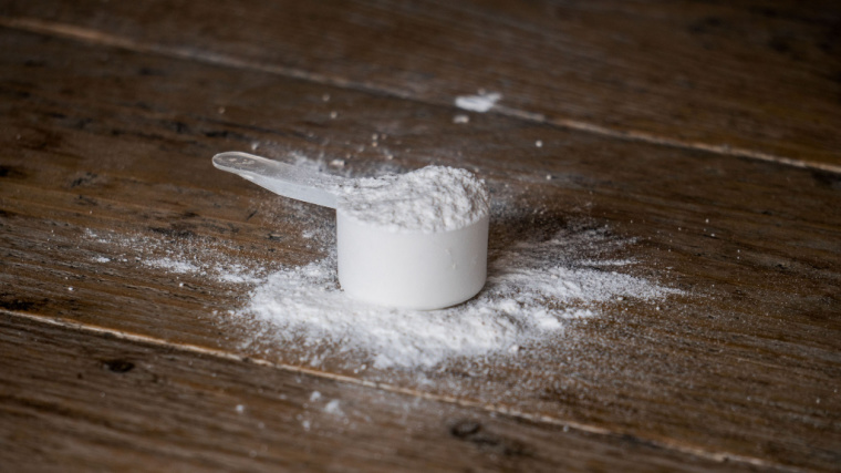 Powder on a table in a scooper