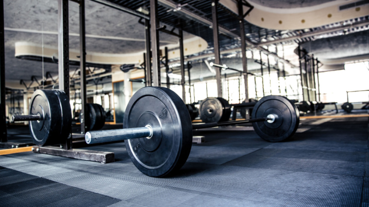Barbell with bumper plates on platform