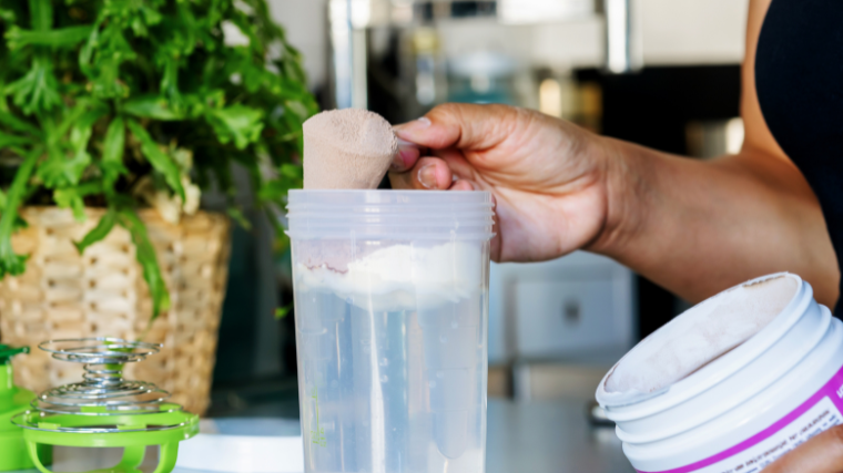 athlete mixes pre-workout drink