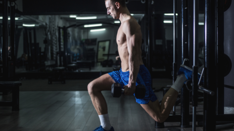 strength athlete in the gym performing bulgarian split squat